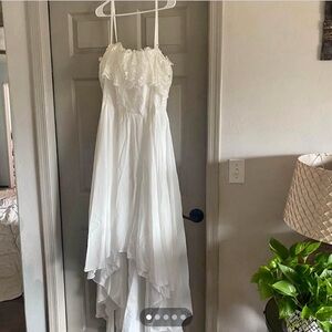Never worn Tulle Lace wedding dress. Hand washable. Zipper up.